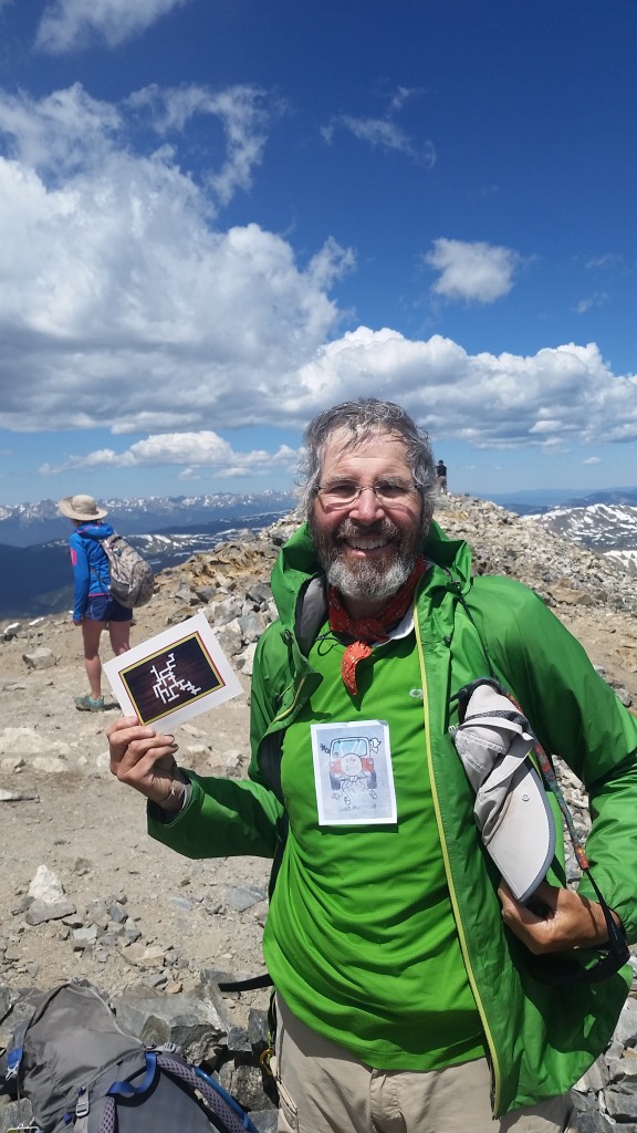 On the summit of Grays Peak with my Anniversary card from Cindy!
