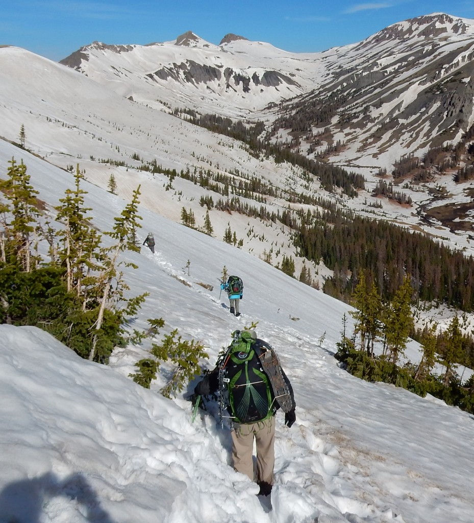 CDT hikers Paul, Chantal and Freebird traverse the snowy ridge above Adams Fork Conejos River, San Juan National Forest, Colorado on June 6.